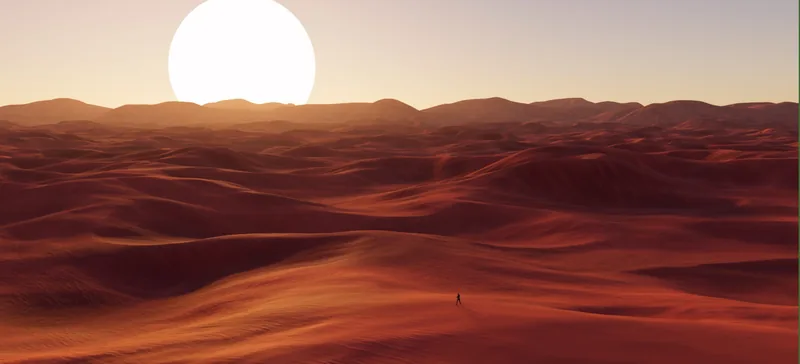 Dunes rouges sous un grand soleil